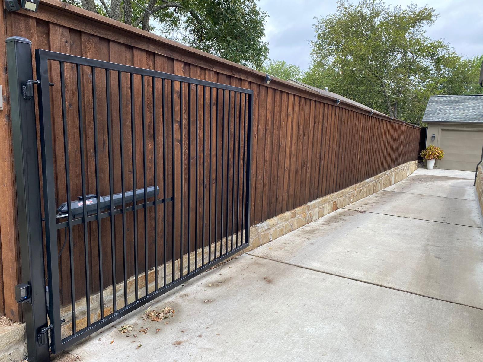 Vinyl fence panels and posts on a DFW property
