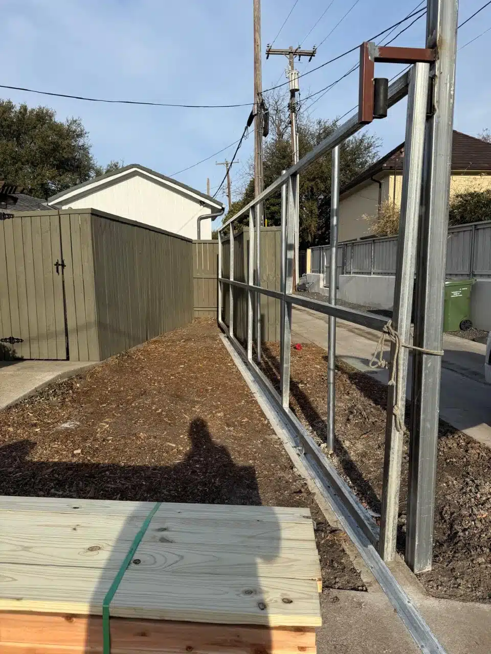Galvanised steel posts and header framed in place before cedar boards are installed