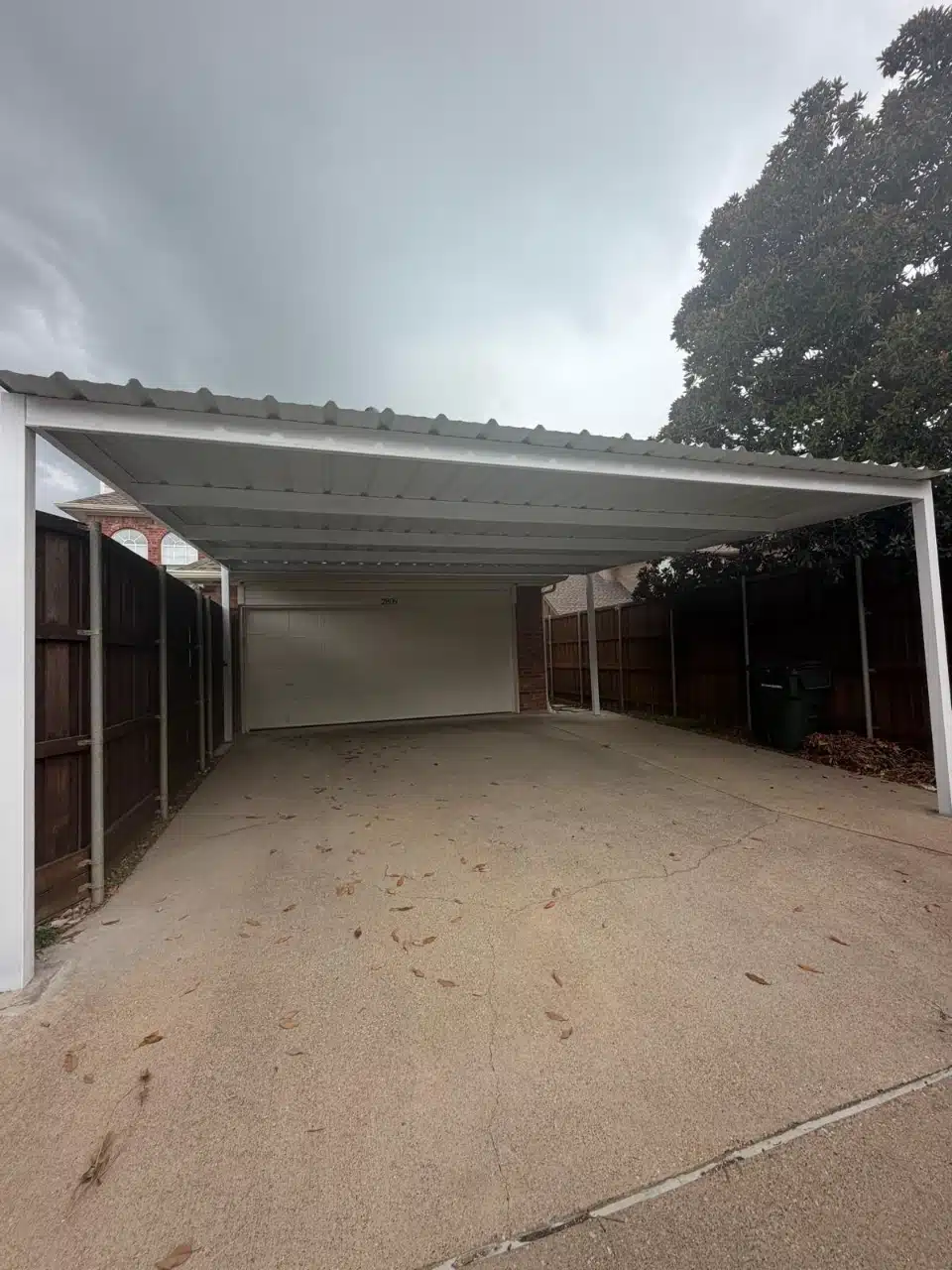 Open span of the finished carport looking down the driveway