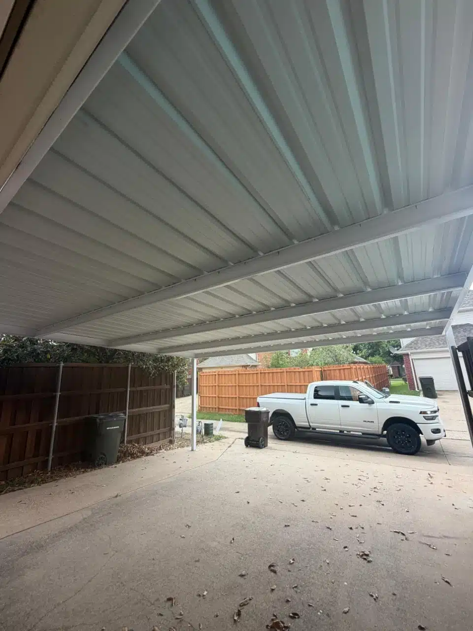 Truck parked under the completed metal carport roof