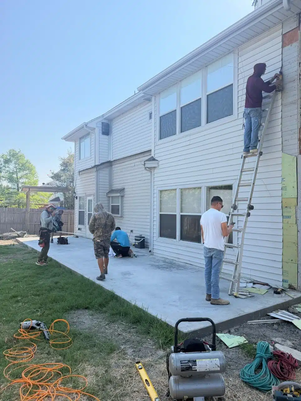 New concrete slab poured alongside the house ready for the addition
