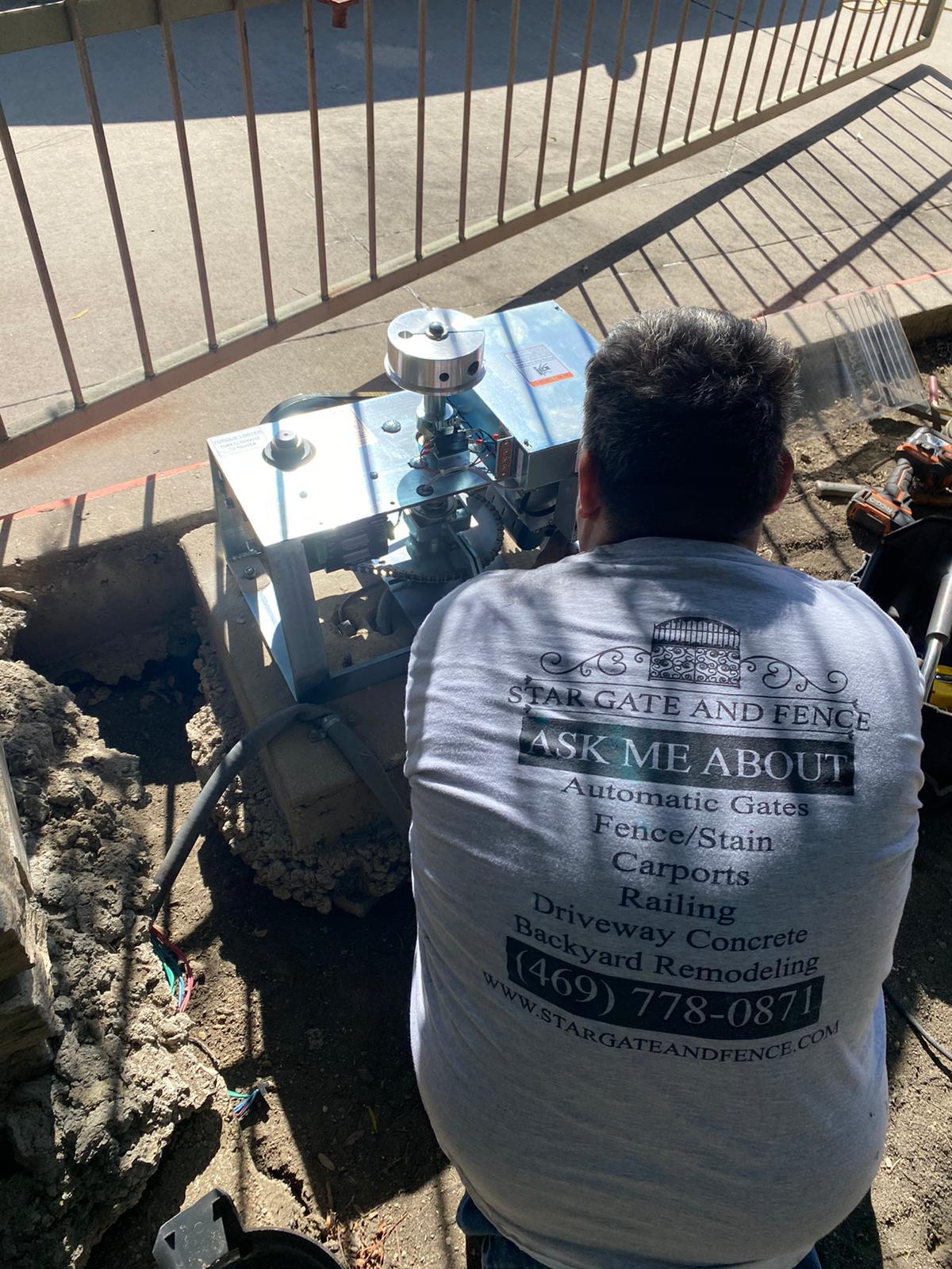 Star Gate and Fence technician fitting the new operator