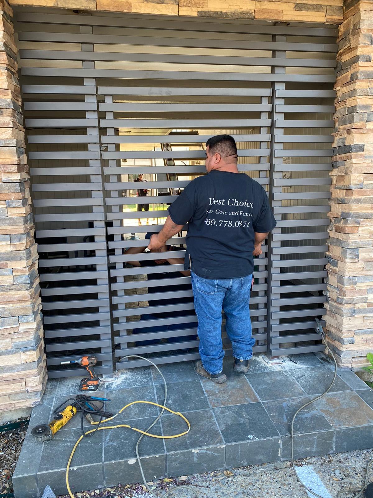 Star Gate and Fence technician fitting a pedestrian gate on site
