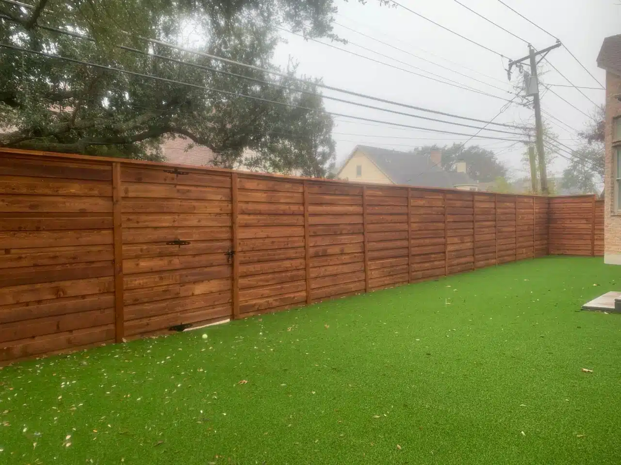 Finished cedar boundary enclosing the back garden
