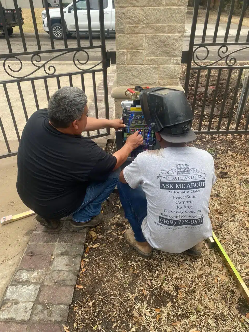 Technicians wiring a Maximum Controls operator on site in DFW
