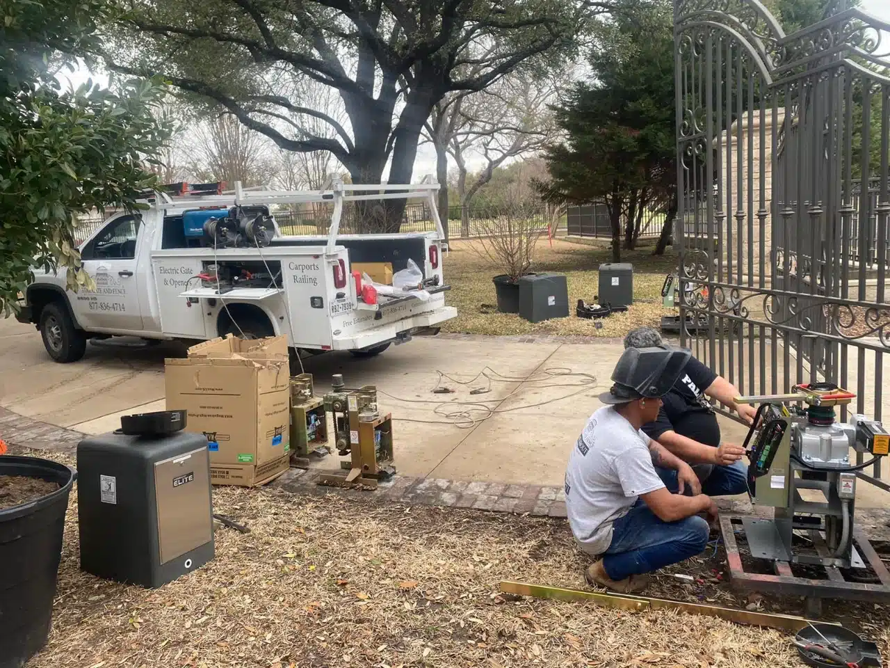 Crew and service truck at the estate entrance during the install