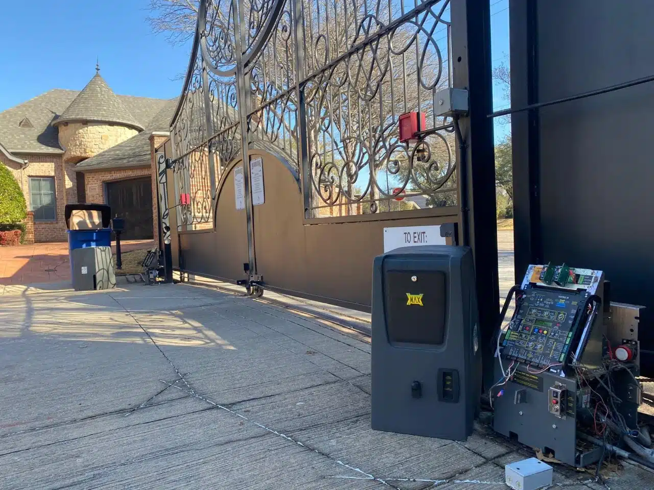 Finished operator and control cabinet at the driveway entrance