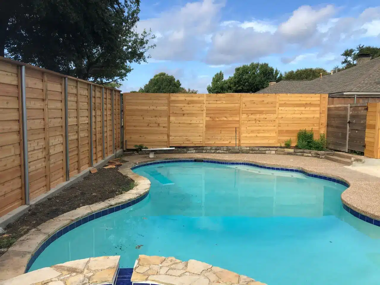 Backyard pool enclosure built to Texas barrier code
